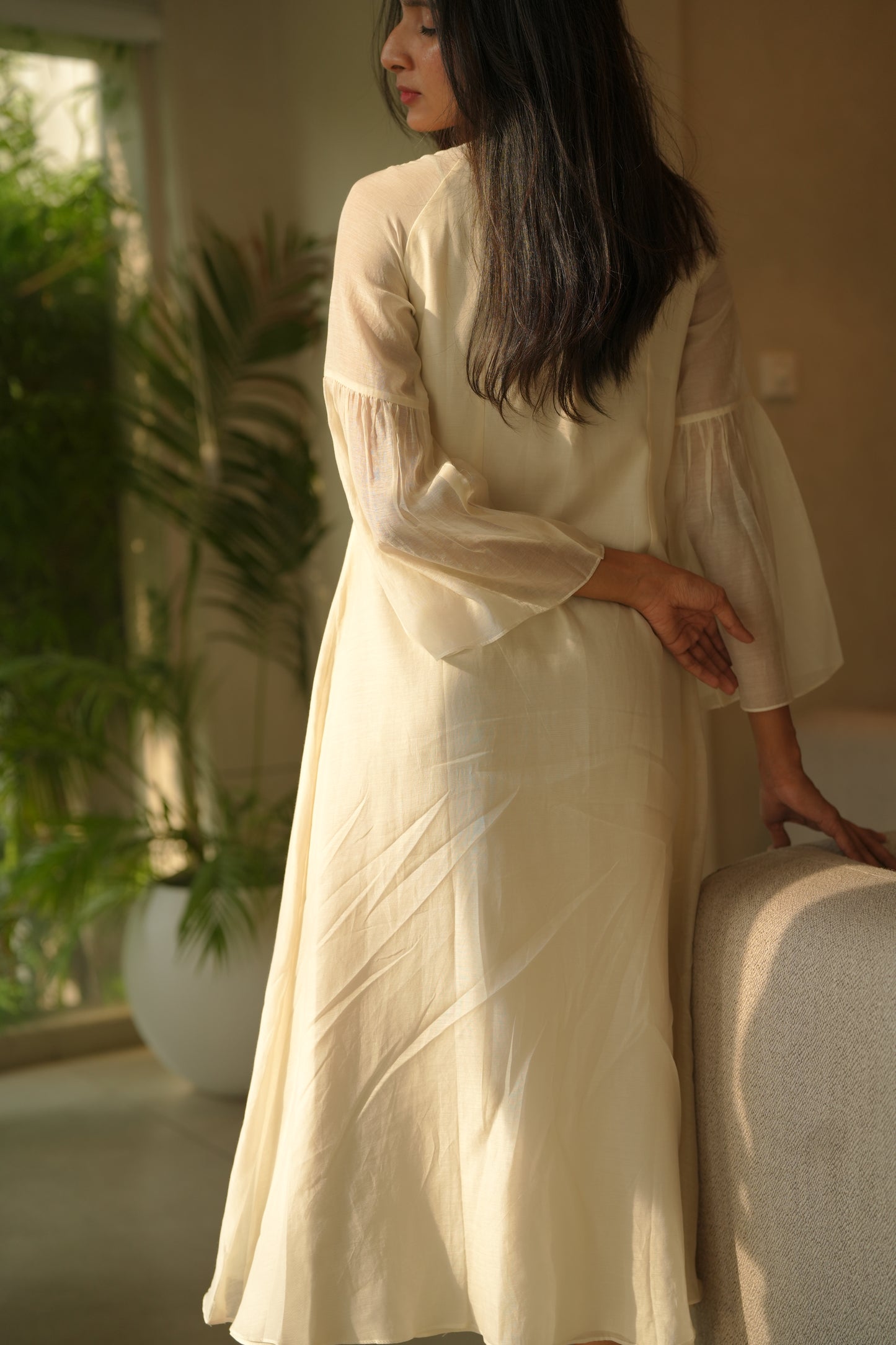 Off white chanderi frock with pink tuck and gathered floral sleeves