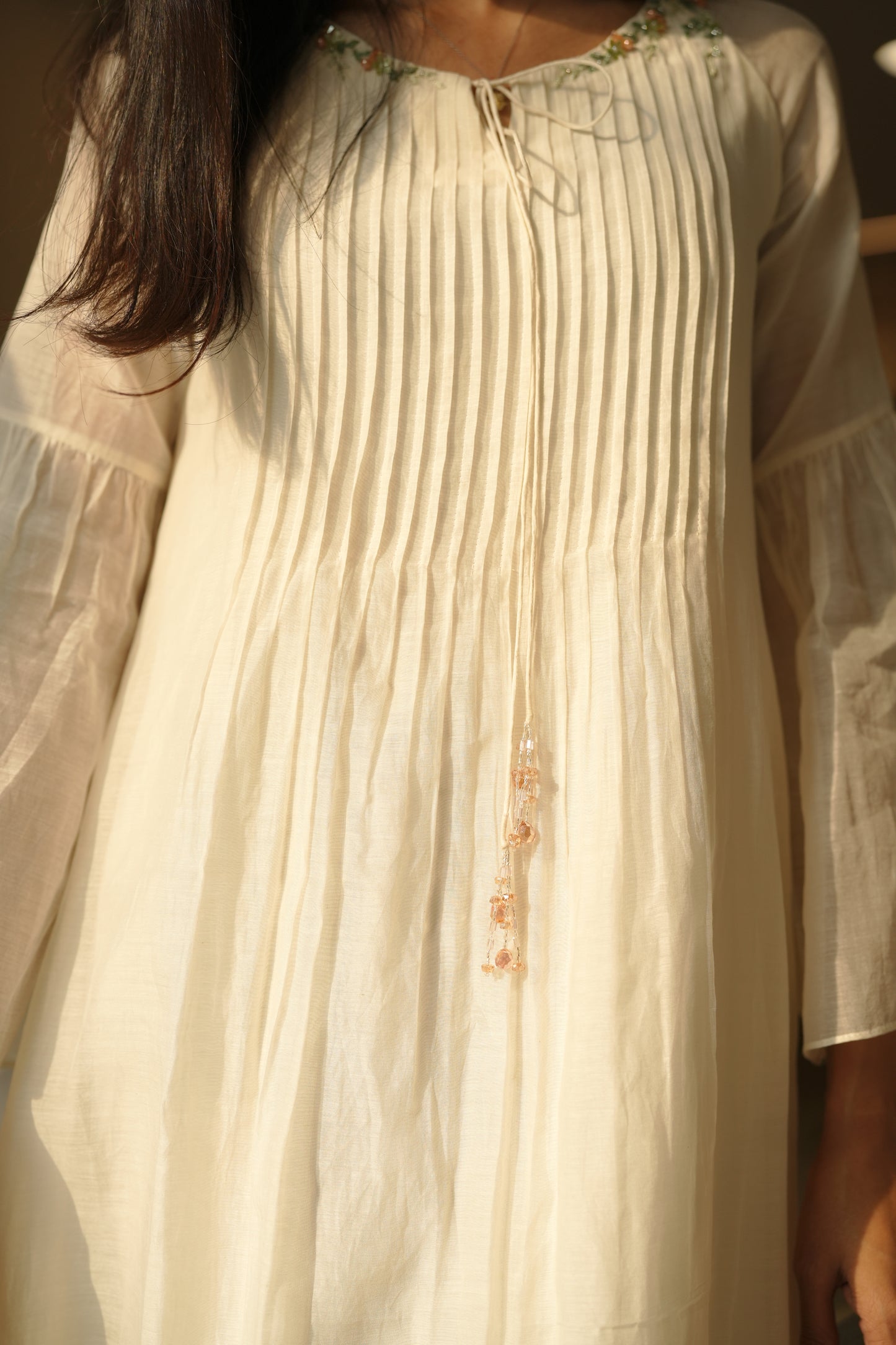 Off white chanderi frock with pink tuck and gathered floral sleeves