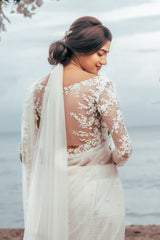 Off-white soft net bridal saree with beautiful floral bunches