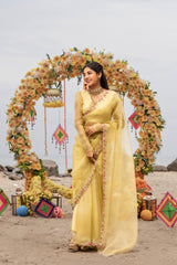 Yellow pure organza saree with beautiful floral bunches