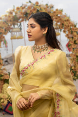 Yellow pure organza saree with beautiful floral bunches