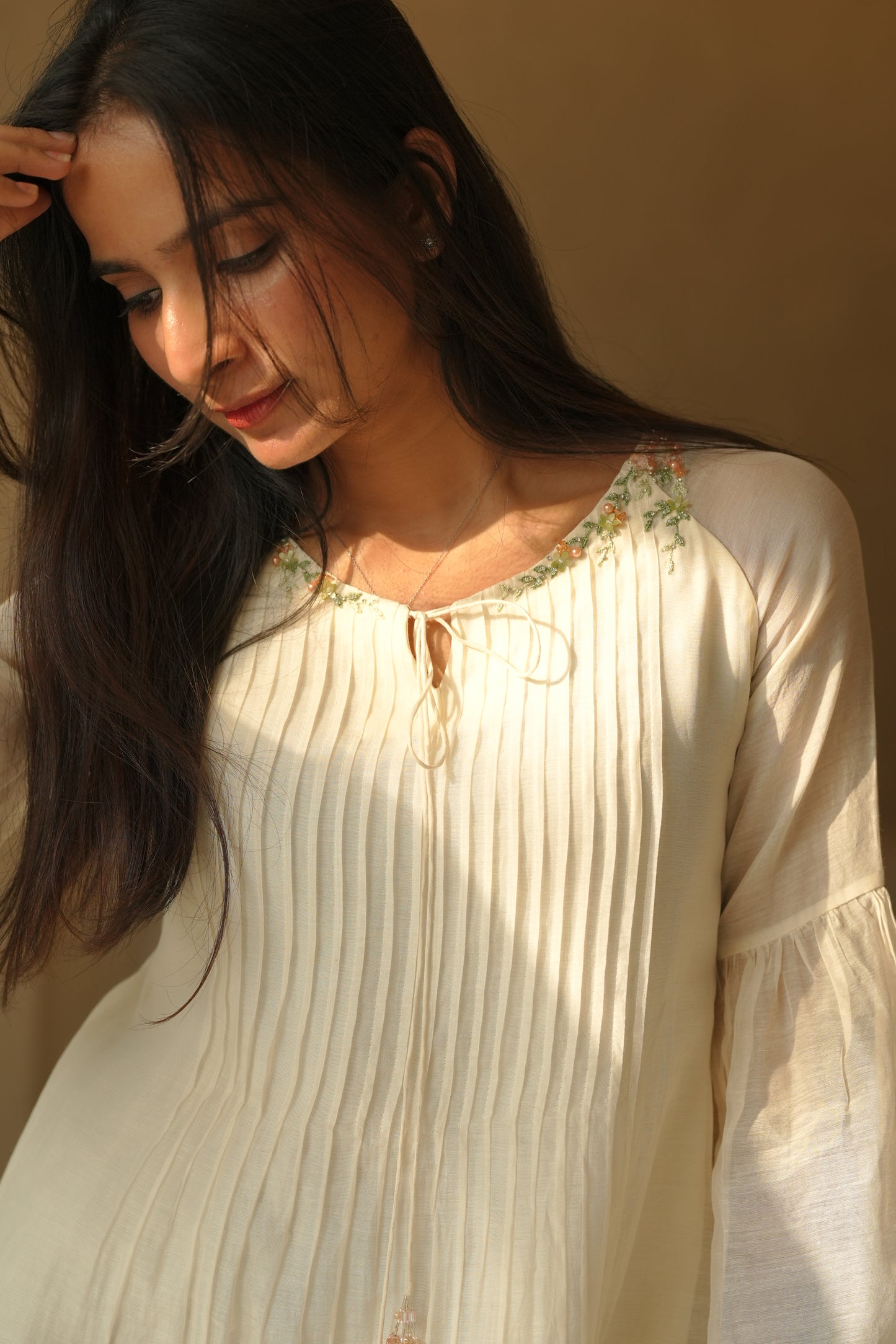 Off white chanderi frock with pink tuck and gathered floral sleeves