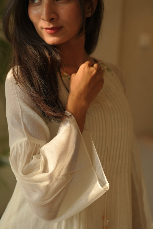 Off white chanderi frock with pink tuck and gathered floral sleeves
