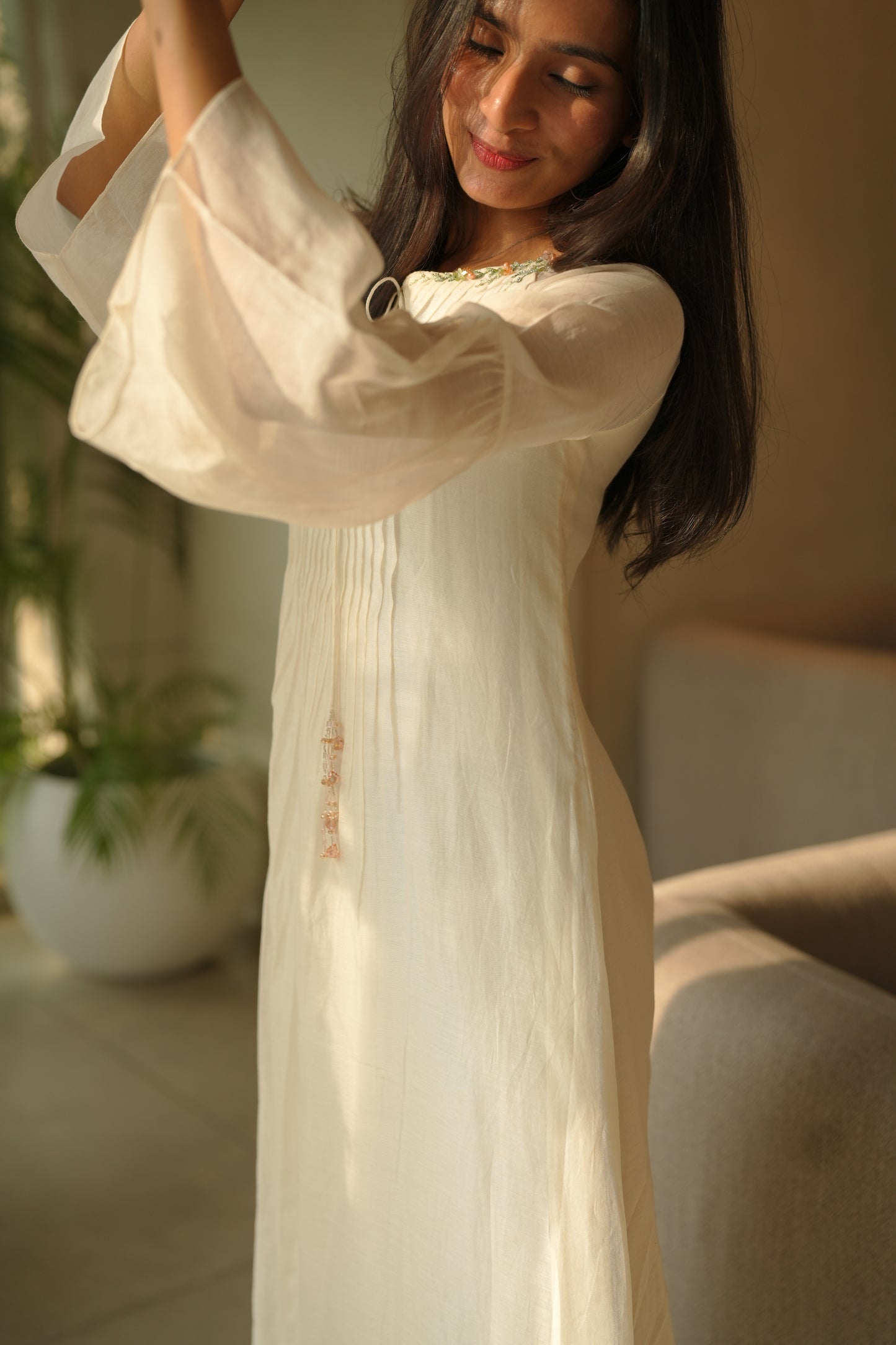 Off white chanderi frock with pink tuck and gathered floral sleeves