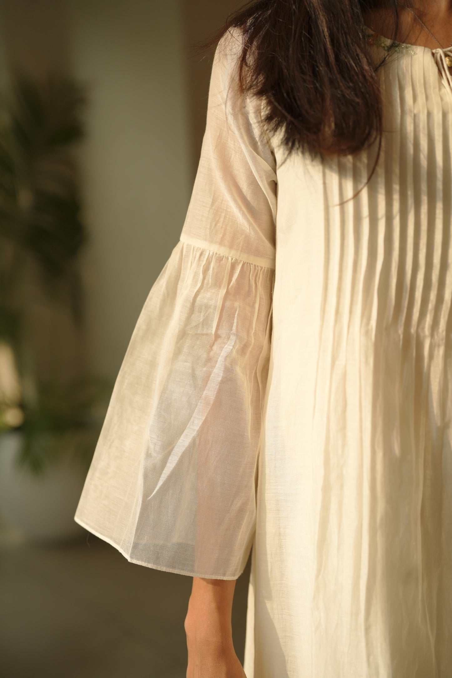 Off white chanderi frock with pink tuck and gathered floral sleeves