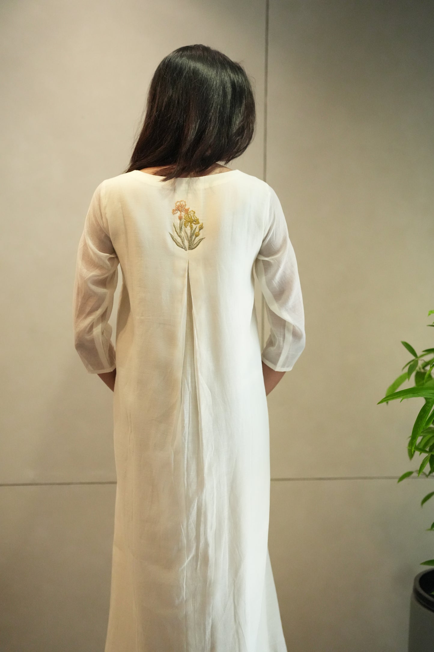 Off white Chanderi frock with pleated yoke and floral embroidery