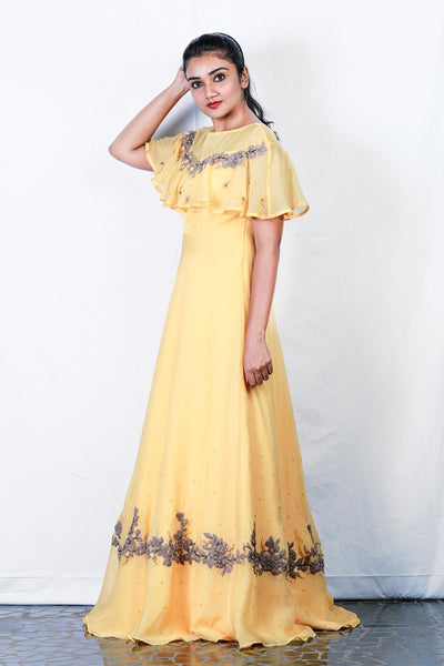 Yellow Sleeveless Gown With Overlapping Attached Embroidered Cape